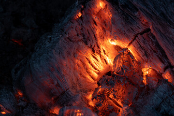 Wood fire. Burning embers with bright color. Wood fire with hot embers and ashes. Background...