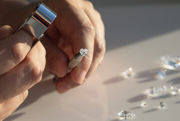 Close up of diamonds in the evaluating process at expert workplace. High quality photo