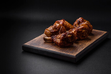 Delicious grilled chicken legs with spices and herbs in teriyaki sauce