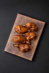 Delicious grilled chicken legs with spices and herbs in teriyaki sauce