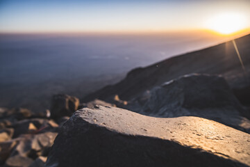 In macro, the smooth surface of a stone from solidified lava on the slope of Mount Ararat, a stone in macro at sunset