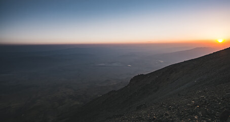 Panoramic mountain landscape at sunset on the rocky slope of Mount Ararat, landscape in the mountains with rocks in the evening