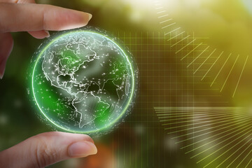 Glass ball in the green forest. Green planet in hand. Technological environment, society and...