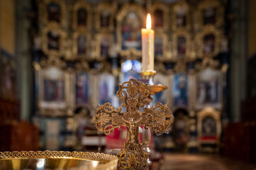 candles and cross in the orthodox church