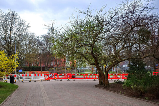 Plastic portable barrier or hazardous area barrier for pedestrians and service personnel. Pedestrian access was closed during construction work.