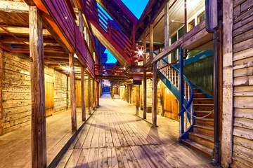 Gordijnen Smalle Straten One of the narrow streets at dusk in famous Bryggen, Bergen, Norway  © Oleksandr Dibrova