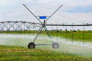 Modern irrigation system at the fertile agricultural field