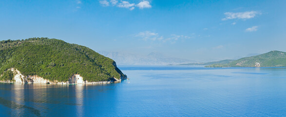 Fototapeta na wymiar Summer Lefkada coastline panorama and sailers in bay (Nydri , Greece).