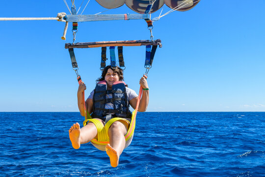 Young woman parasailing at the Red sea, Egypt
