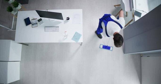 Janitor Cleaning White Desk