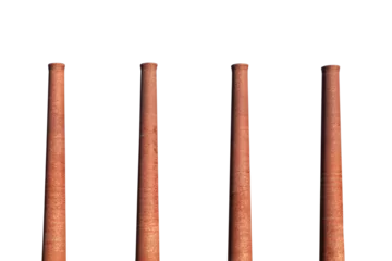  Four old brick factory smokestacks isolated with cut out sky. © trekandphoto