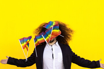 Fototapeta na wymiar Man in formal suit holding rainbow flag isolated. Business man holding rainbow flag