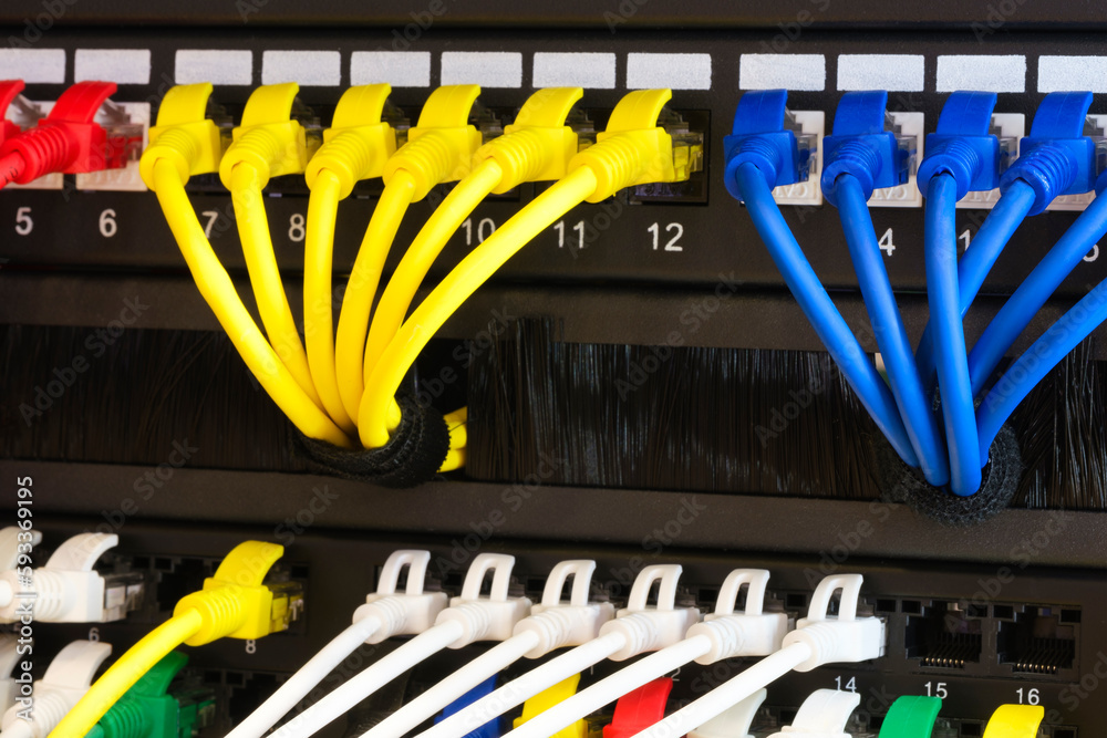Poster multi colored network cables connected to switch, network technology concept