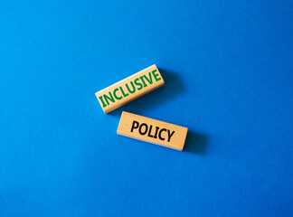 Inclusive policy symbol. Concept word Inclusive policy on wooden blocks. Beautiful blue background. Business and Inclusive policy concept. Copy space