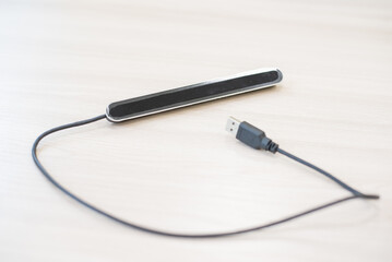 A device that allows people with physical disabilities to control a computer. 