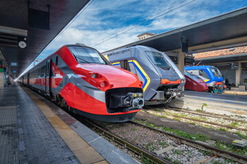 High speed trains on the train station at sunny day Venice, Italy. Beautiful modern intercity...