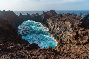 El Hierro Island. Canary Islands, the Arco de la Tosca incredible natural monument of an arch by the sea