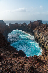 El Hierro Island. Canary Islands, the Arco de la Tosca incredible natural monument of an arch by...
