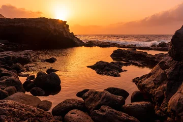 Foto op Canvas El Hierro Island. Canary Islands, landscape in the natural pool of Charco Azul at sunset © unai