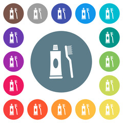 Toothbrush and toothpaste tube flat white icons on round color backgrounds