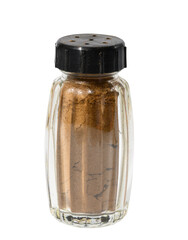 Transparent glass jar with ground cinnamon on a white isolated background, spice