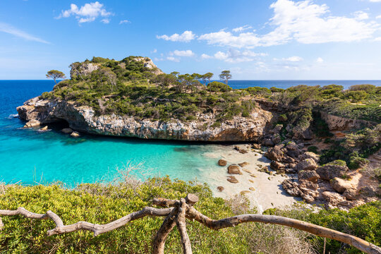 Mallorca beach: "Es Cal&oacute; des Moro", a small cove with crystal clear turquoise water, near the town of Santany&iacute; (Majorca, Balearic Islands, Spain) seen from the path leading to the beach.