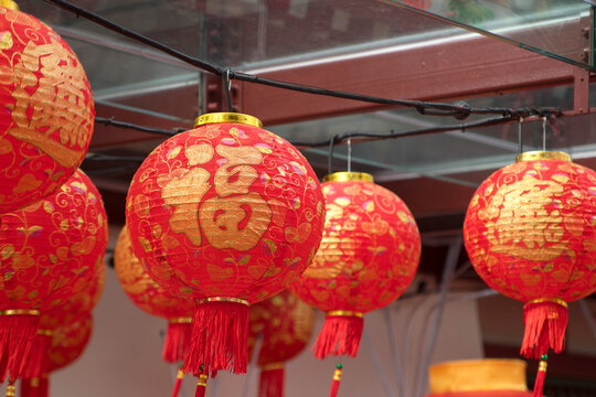 Lanterns hang outside of Buddha Tooth Relic Temple in Chinatown, Singapore