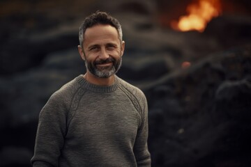 Medium shot portrait photography of a pleased man in his 40s wearing a cozy sweater against a volcano or lava background. Generative AI