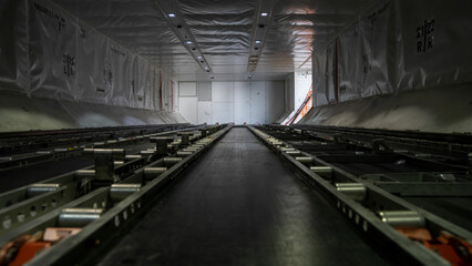Interior shot of an empty cargo compartment on a 787 commercial airplane.