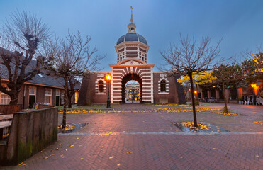 The old city gate Morspoort in Leiden at sunrise.