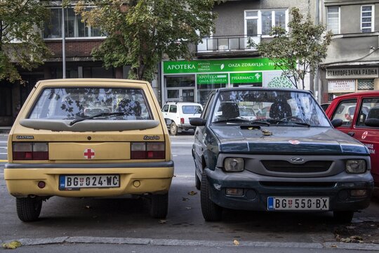 BELGRADE, SERBIA - NOVEMBER 2, 2014: Two Zastava and Yugo 45 cars parked. Also known as Koral, it is a generic name for a family of cars built by Serbian manufacturer Zastava Automobili.