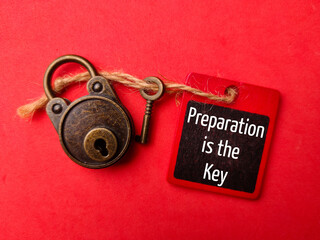 Padlock and key with the word Preparation is the key on a red background
