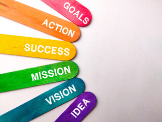 Colored ice cream stick with word GOALS ACTION SUCCESS MISSION VISION IDEA