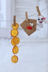 Slices of dried oranges, candied fruit, envelope and hearts, mail, holiday greetings, photo...