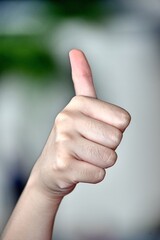 A Woman With Thumbs Up