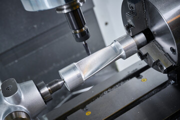 Milling machine tool operates with detail in workshop