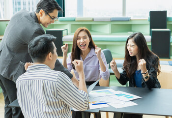 group of young asian students happy greeting together. group of students studying, learning, tutoring in library