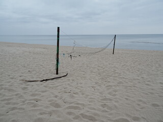 Old beach volleyball net on the beach