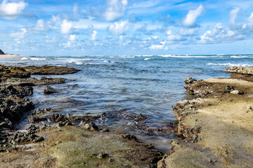 Great barrier of stones and coral on the beach of Sibauma in the northeast of Brazil.