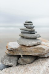 Fototapeta na wymiar stack of stones in the beach for relaxation, and zen meditation 