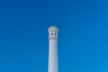 Muslim mosque with white trim and blue dome