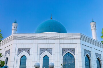 Muslim mosque with white trim and blue dome