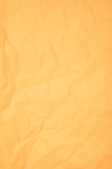 The Texture of vertical yellow crumpled paper.