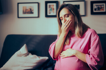 Pregnant Woman in her Third Trimester Feeling Sick at Home. Mother to be suffering from morning sickness late into her pregnancy
