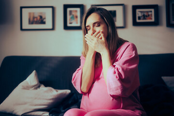 Pregnant Woman in her Third Trimester Feeling Sick at Home. Mother to be suffering from morning...