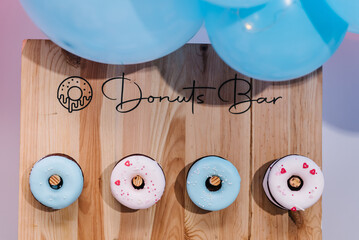 Donuts bar. Baby Shower party decor. Delicious reception. Celebration concept. Trendy candy bar....