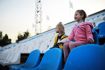 Plastic chairs in the stands of a sports stadium. Cheer on the stands of the stadium.