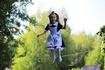Children in school uniforms walk on the street. Children rejoice and have fun at the end of the school year. Holidays.