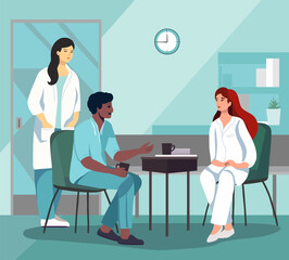 Hospital scene with diverse group of health care professionals casually chatting in a break room. Medical staff - doctors and nurses in rest pause in medical office interior - 593431721