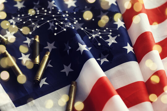 Bullets with an USA flag on a black wood background